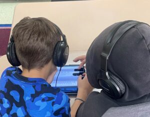 two students with headphones on