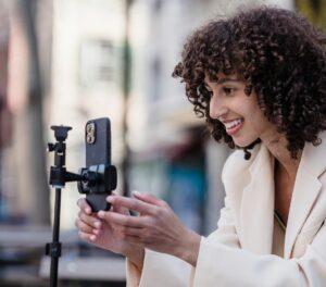 woman setting up camera to record herself