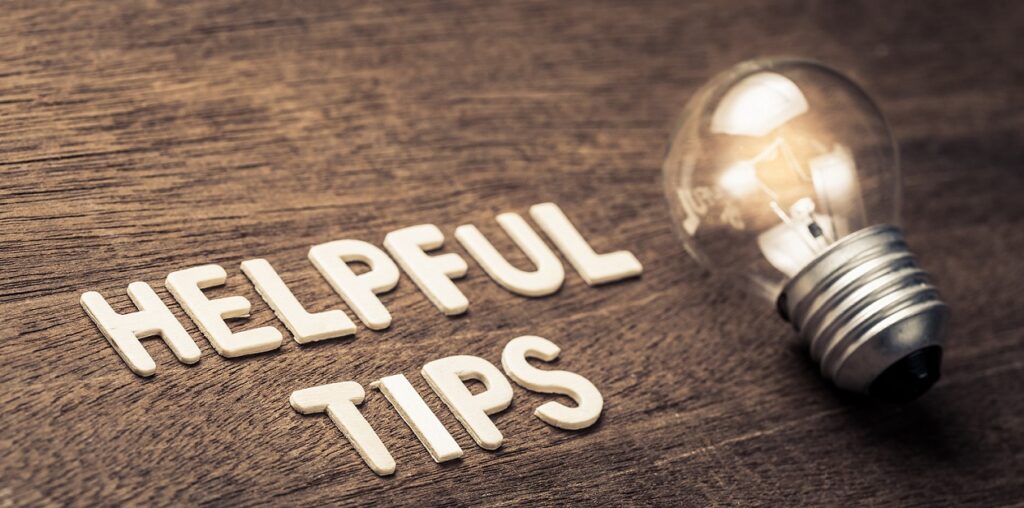 Helpful Tips spelled out next to a light bulb (photo by Patpitchaya/Adobe Stock)