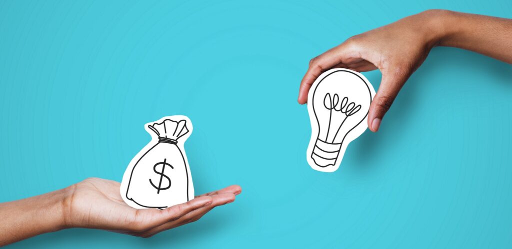 Hands with dollar sign bag and light bulb over blue background