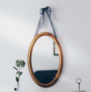 mirror hanging on wall