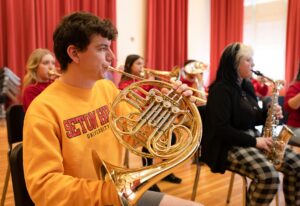 student playing French horn