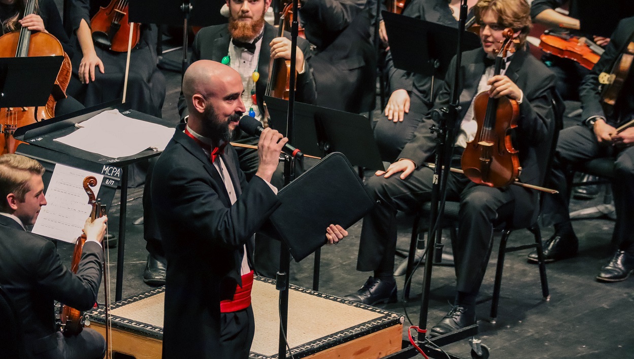 music teacher speaking during performance