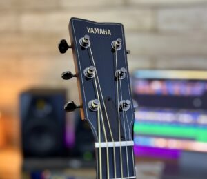 close up of guitar headstock to show proper winding of strings around the tuning posts