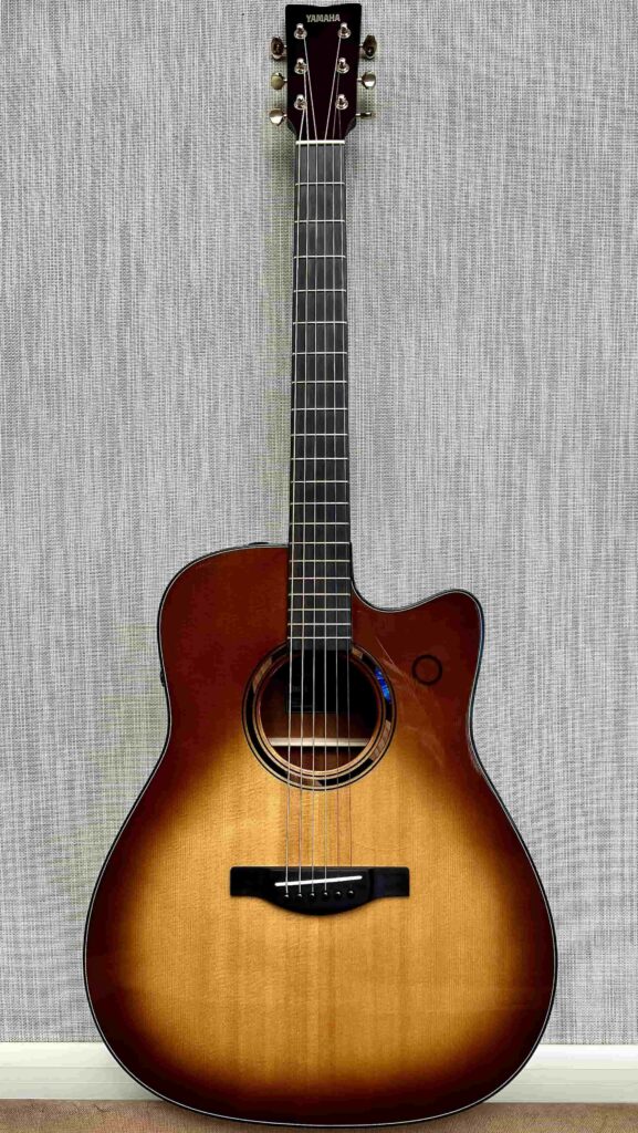 An acoustic guitar with a sunburst finish.