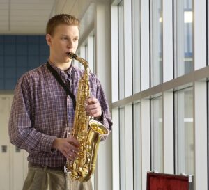 student playing the saxophone