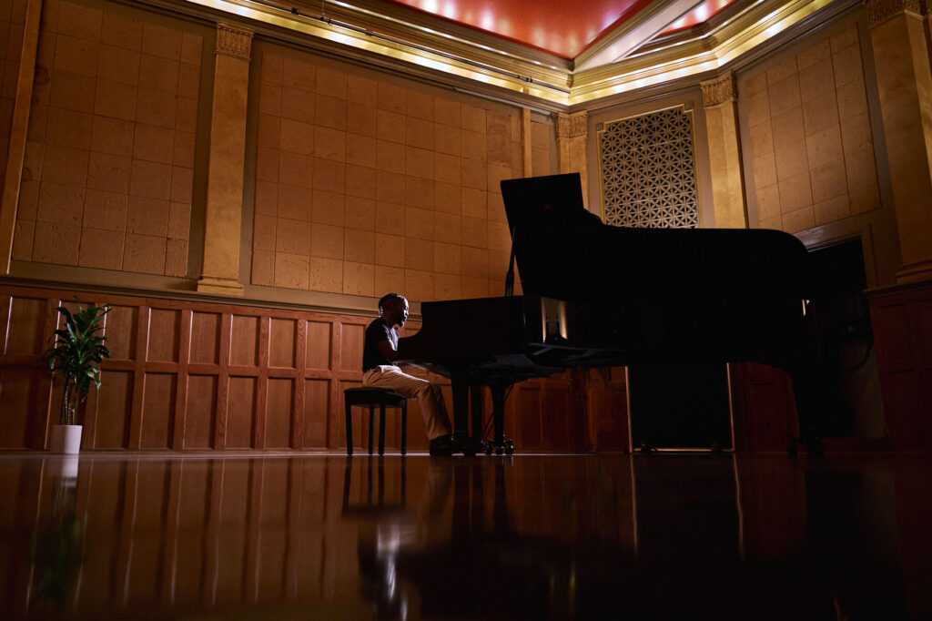Will Wells on a grand piano