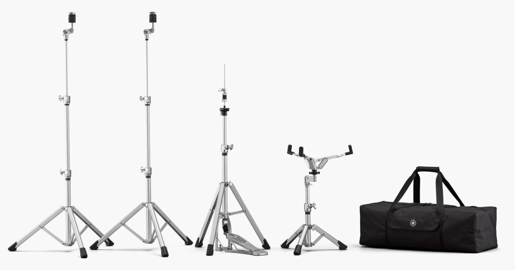 Two cymbal stands, a hi-hat stand, a snare drum stand and a soft carrying case.