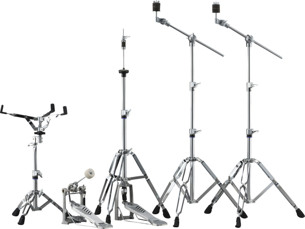 A snare drum stand, a bass drum pedal, a hi-hat stand and two cymbal stands.