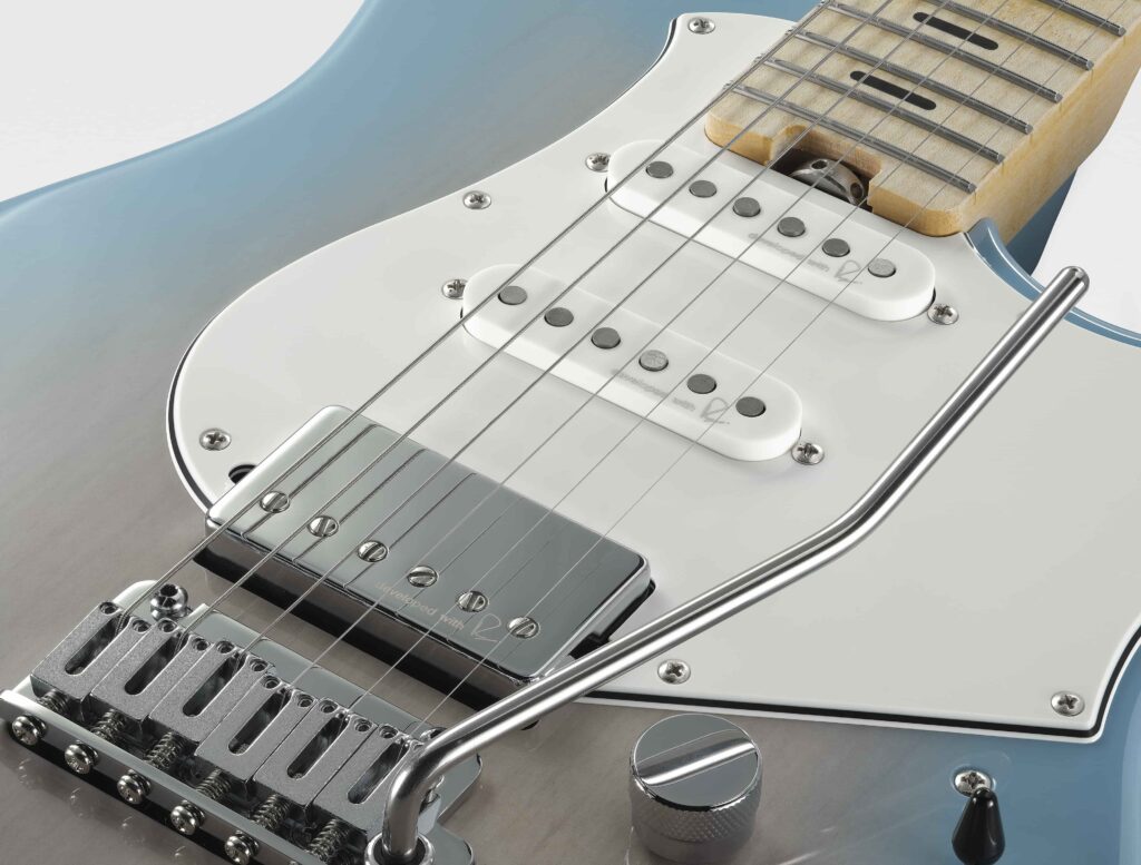 Close-up of three electric guitar pickups.