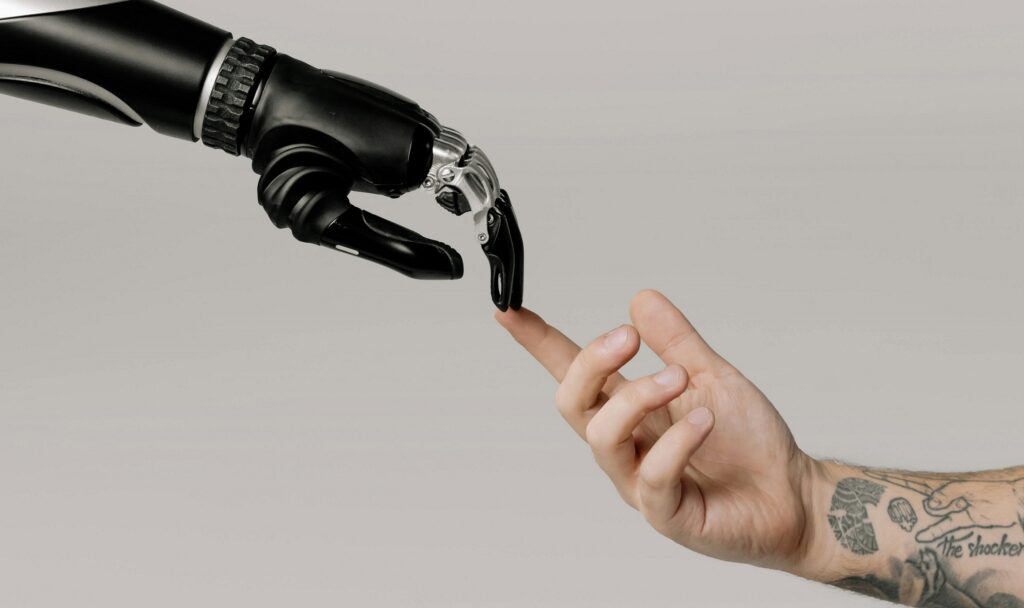 robot hand and human hand touching