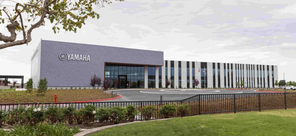 An exterior shot of an office building with the word Yamaha on the front.