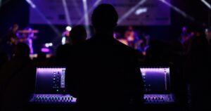 person at electronic controls