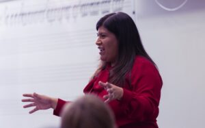 music educator speaking in front of class