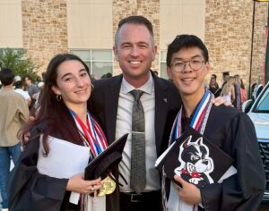 teacher with two high school graduates