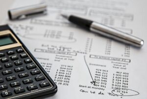 budget with calculator and pen