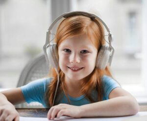 little girl wearing headphones