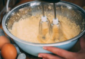 mixing batter in bowl
