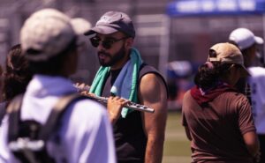 music educator outdoors for marching band rehearsal