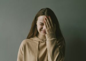 frustrated woman with hand to her face