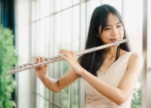 student playing flute