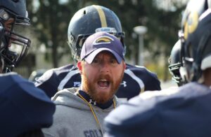football coach with football players