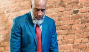 man looking sad with his head down
