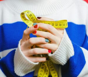 woman holding measuring tape