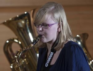 female student playing the saxophone