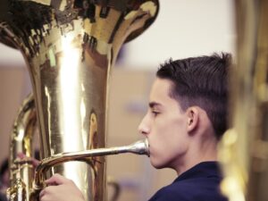 student playing the tuba