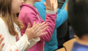 students clapping