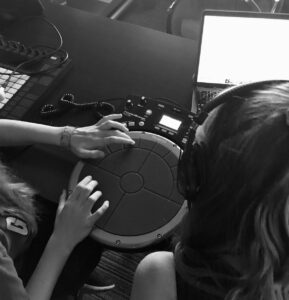 two NVAA students working at DAW 