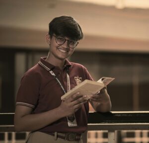 happy student holding open book