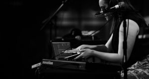 Erin Barra performing on her digital music station