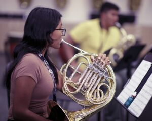 female French horn player