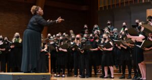Coty Raven Morris and her choir students during a performance 
