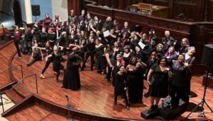 Coty Raven Morris and her choir students during a performance