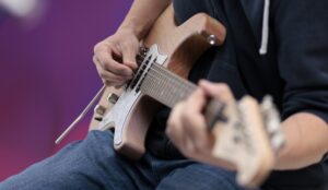closeup of someone playing an electric guitar