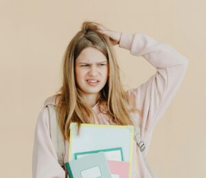 confused student scratching her head
