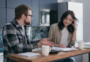 man over-explaining to a woman, who looks disinterested