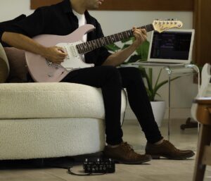 guitar player with pedal effects