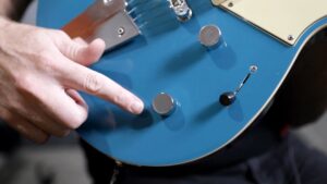 closeup of guitar's tone control