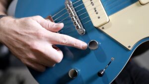 close up of guitar's volume knob