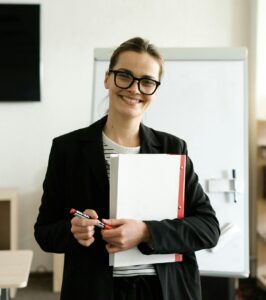 happy woman holding notebook