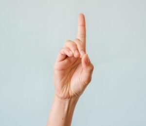 hand with index finger pointing upward