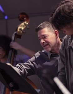 music teacher helping student