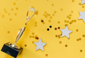 trophy, stars and confetti