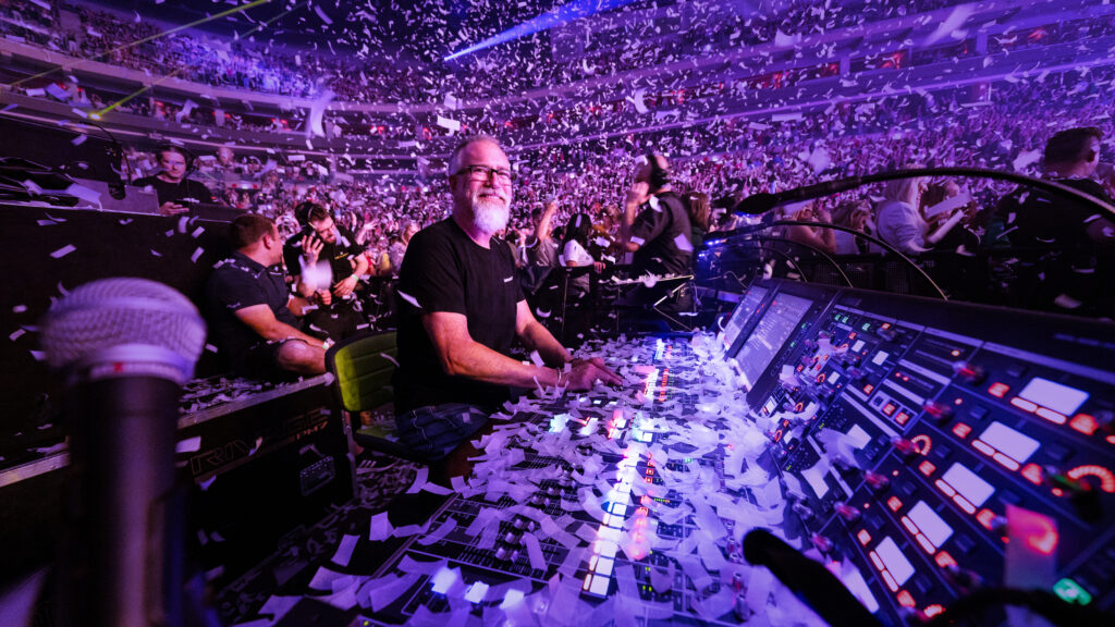 man using audio mixer at concert