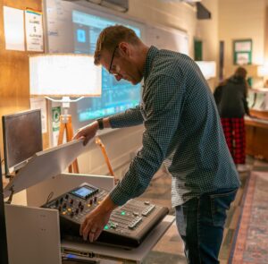 Bob Habersat with sound equipment in choir room