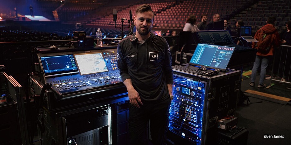 man next to audio mixer